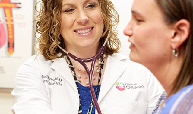 Dedicated healthcare professional examining a patient.