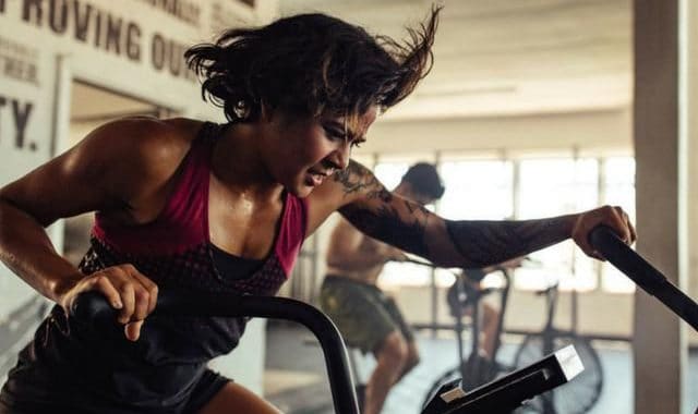 High-intensity workout at Bali Beach Resort gym for health and fitness; Bali Stay fitness center.